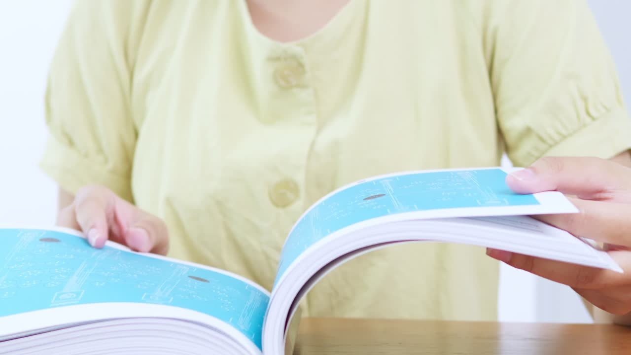 Reading a magazine at home indoor lifestyle cozy atmosphere close-up view relaxation concept