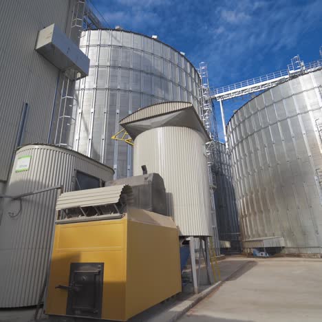 metal grain elevator in agricultural zone. grain warehouse