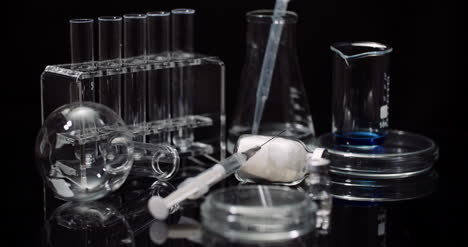 Laboratory-Equipement:-Syringe-And-Medicine-Test-Tubes-And-Flasks-Rotating-On-Black-Background-5