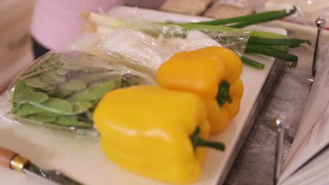 Close-Up-Of-Food-And-Knife-Placed-On-Cutting-Board-In-4K