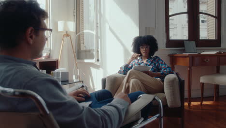 female psychologist and male patient having therapy session