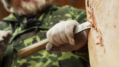 wood carving by an elderly man