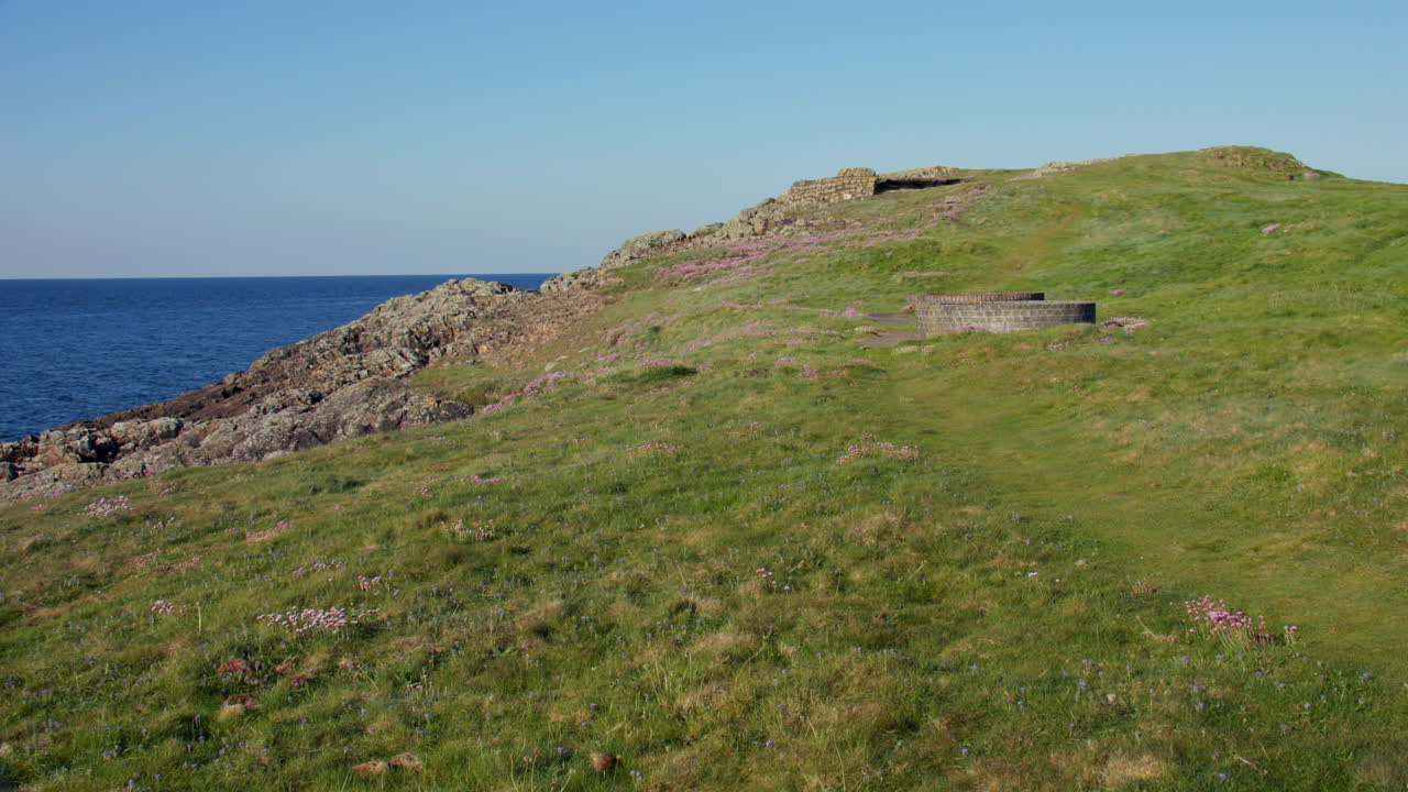 Extra wide shot of Derelict military infrastructure at the headland at Hafan y Môr on Pen-y-chain, Pwllheli