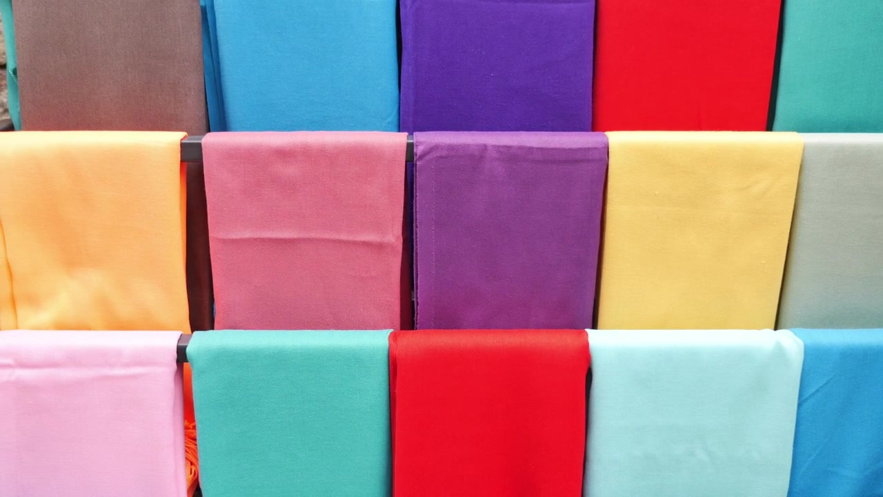 Colorful Fabric Scarves Displayed on a Rack