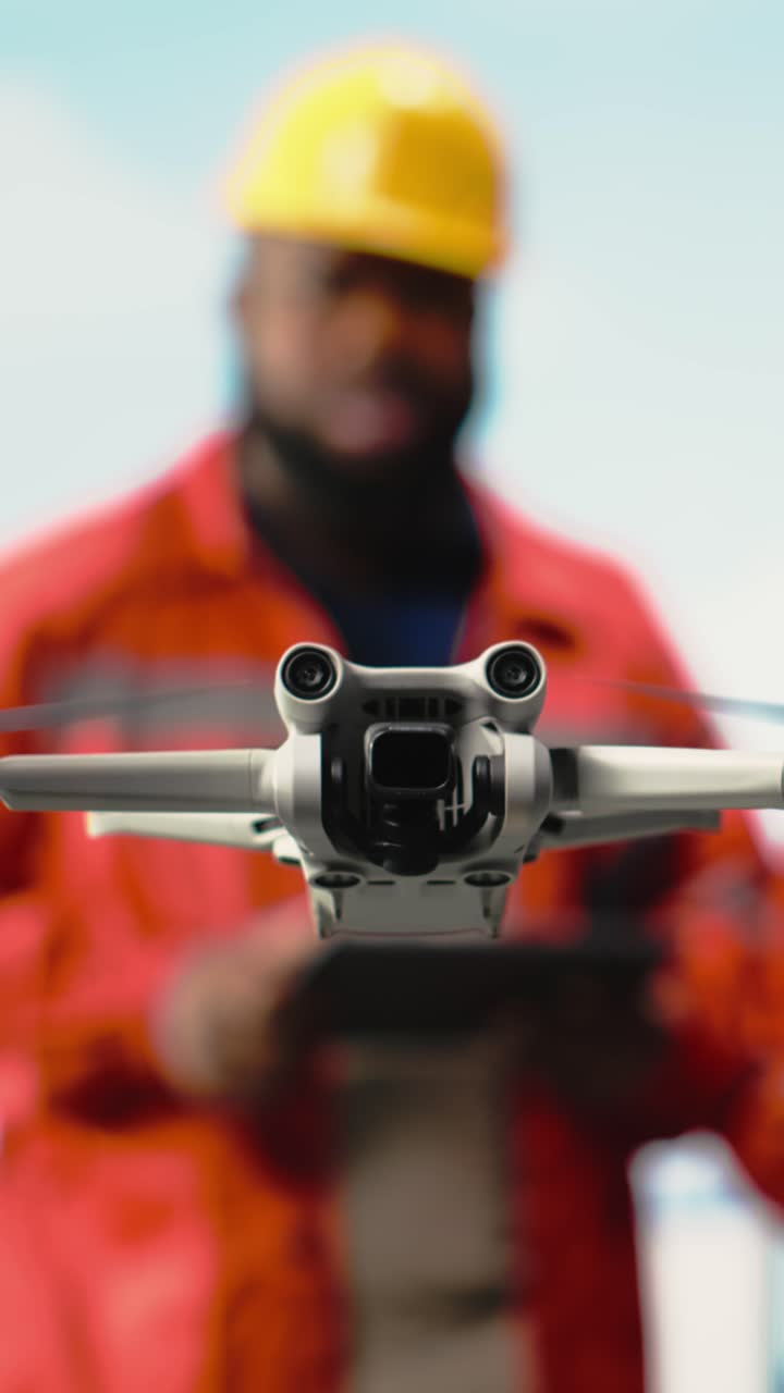 Vertical video Close up of drone gadget used by drilling rig technicians