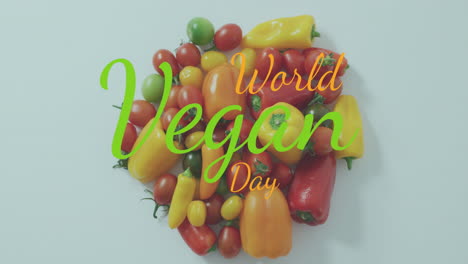 animación del texto del día mundial vegano sobre verduras sobre un fondo blanco