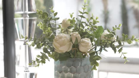 elegant roses on the bridal ceremony party table.