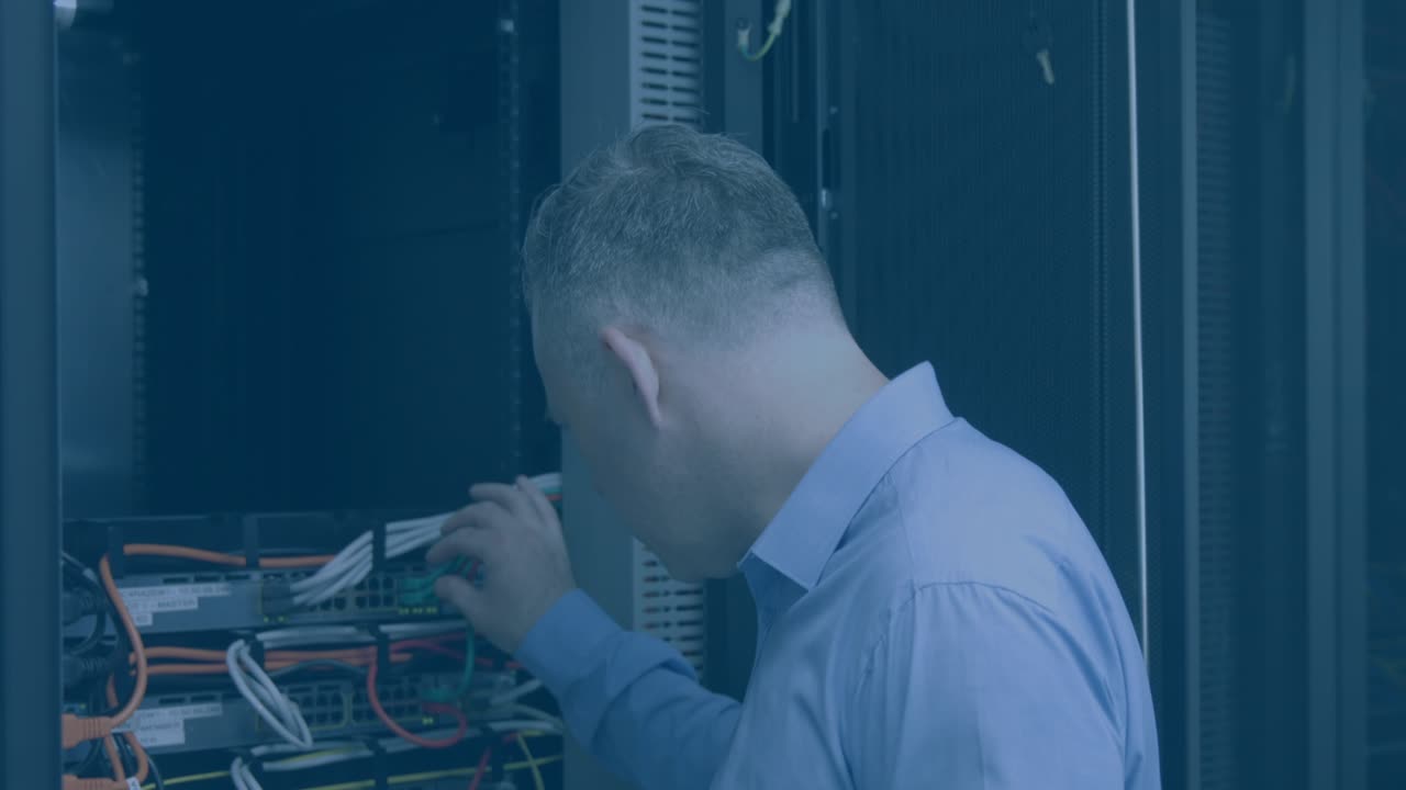Animation of media icons over caucasian male worker inspecting server room