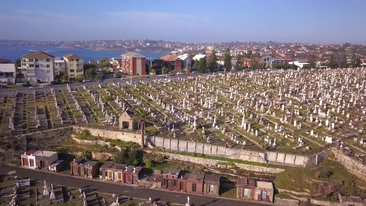 Reverse aerial shot of luxury Cemetery in the suburb of Sydney, Australia with beautiful ocean view.
