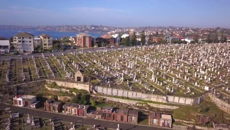Reverse aerial shot of luxury Cemetery in the suburb of Sydney, Australia with beautiful ocean view.