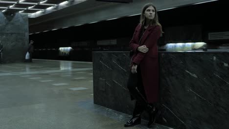 woman waiting in a metro station