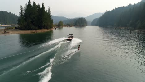 man wakeboarding with motorboat in the river 4k