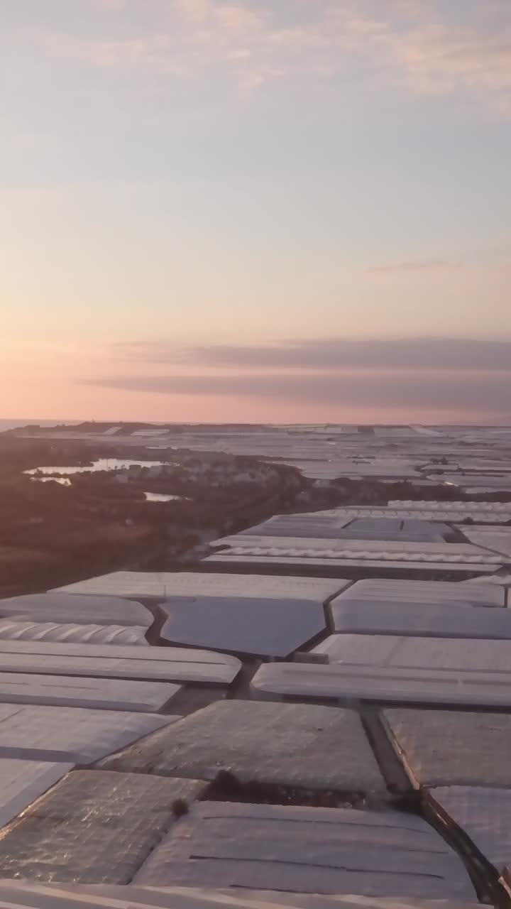 Sunrise/Sunset over a Greenhouse Farm