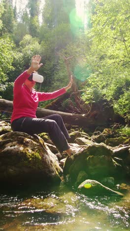 woman using vr headset in a forest by a river