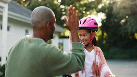 Dad,-girl-child-and-high-five-with-bike