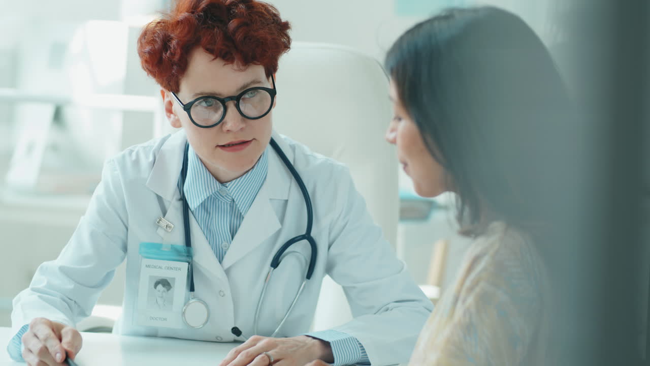 Female Doctor Giving Consultation to Woman