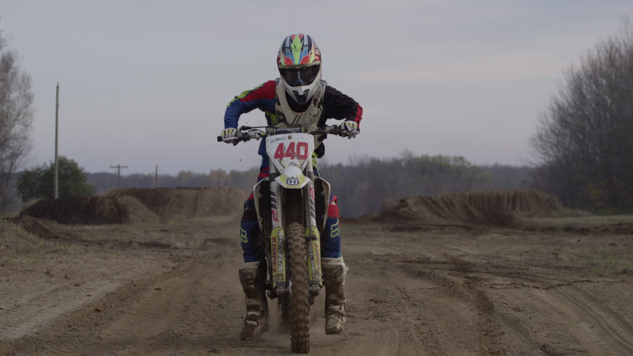 Motocross rider starting up bike
