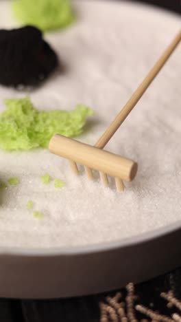 miniature zen garden with rake