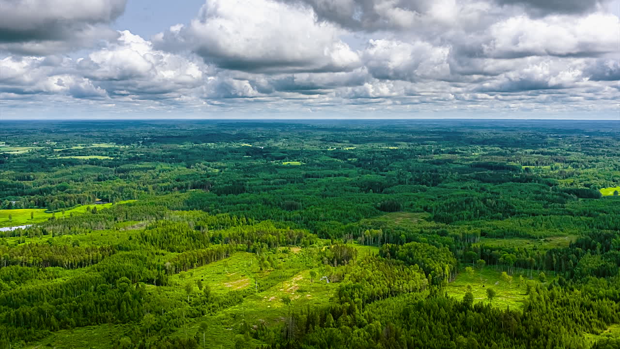 Hyperlapse of vast green landscape under dramatic cloudy skies