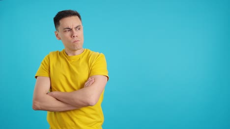 man in yellow shirt with various expressions on blue background