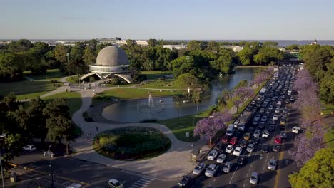 aerial pull out view of traffic near galileo galilei planetarium in buenos aires