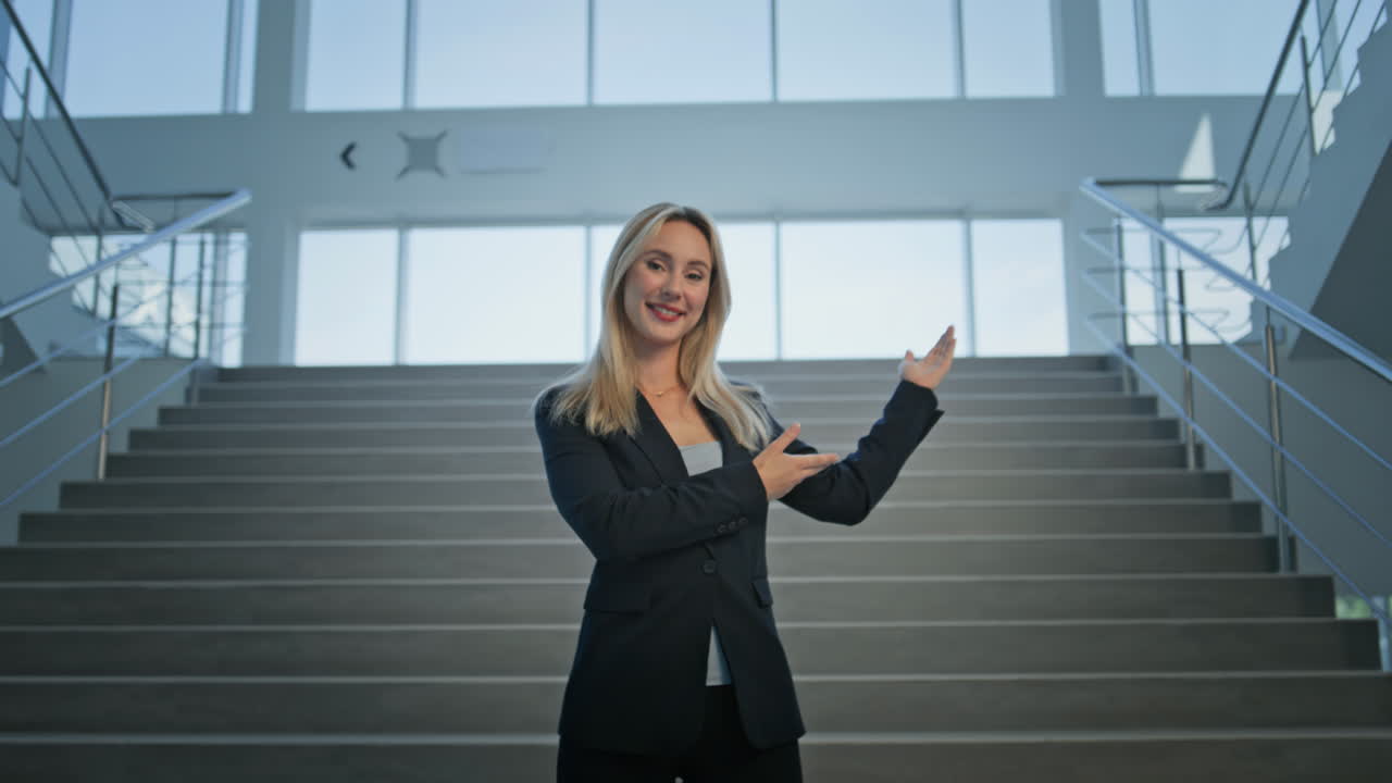 Professional businesswoman smiling confidently in modern office closeup zoom out