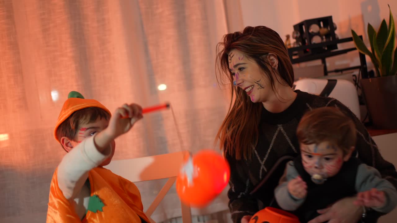 Family Celebrating Halloween with Costumes and Face Paint