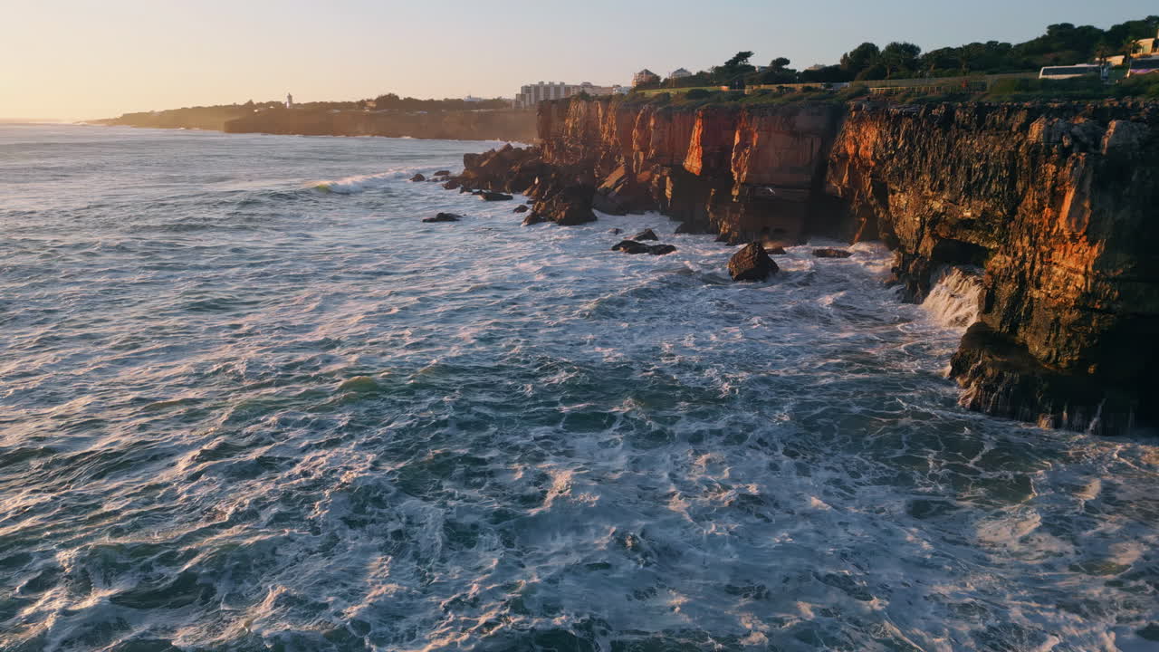 Evening seascape rocky seacoast with foaming waving ocean water aerial view.