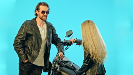 Talking,-motorcycle-and-couple-on-blue-background