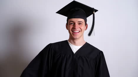 happy young graduate celebrating by throwing cap