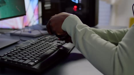 close-up of professional cyber gamer holding joystick