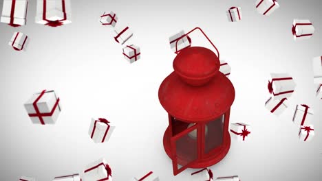 animación de regalos que caen sobre una linterna sobre un fondo blanco