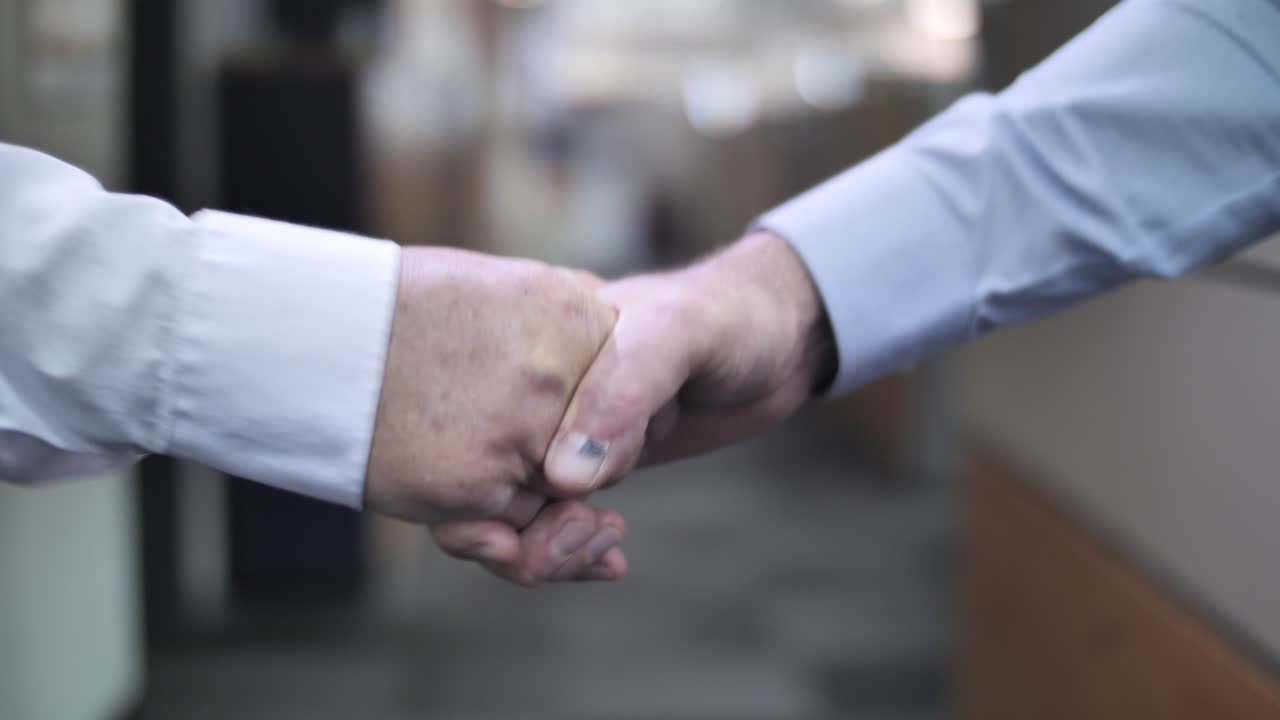 Man firm handshake, positive greeting gesture for friendly relations