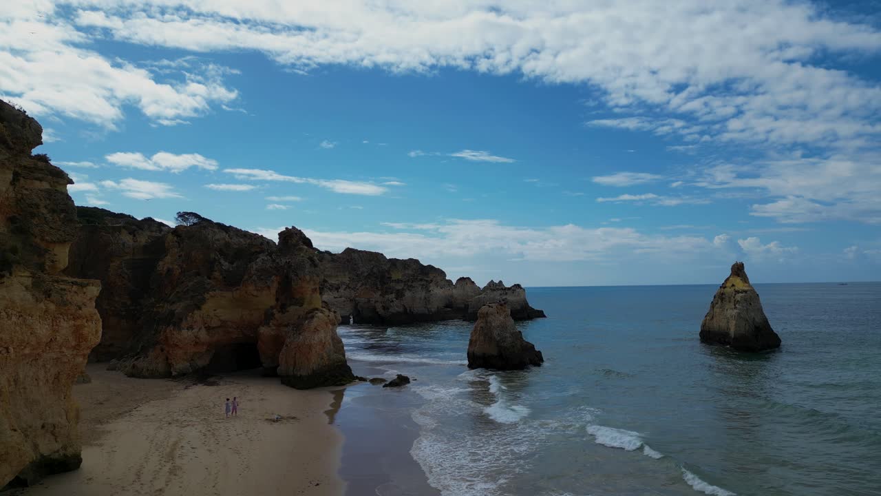 The serene beauty of Alvor's coastline, a peaceful beach perfect for summer relaxation. Golden sands meet gentle waves, offering tranquility by the Portuguese seaside.