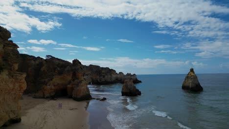 the serene beauty of alvor's coastline, a peaceful beach perfect for summer relaxation. golden sands meet gentle waves, offering tranquility by the portuguese seaside.