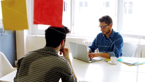 Business-executives-interacting-with-each-other-in-conference-room