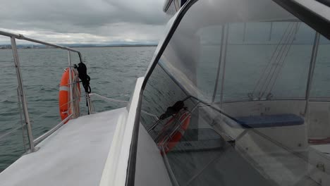 a boat deck bobbing at sea on a stormy day