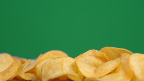 crispy potato chips slowly rotate.