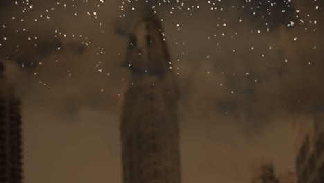 animation of snow falling over cityscape on brown background