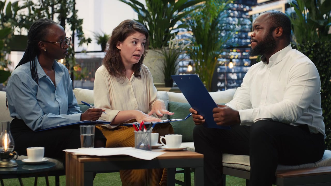 Businesswoman presenting proposal during rooftop team discussion