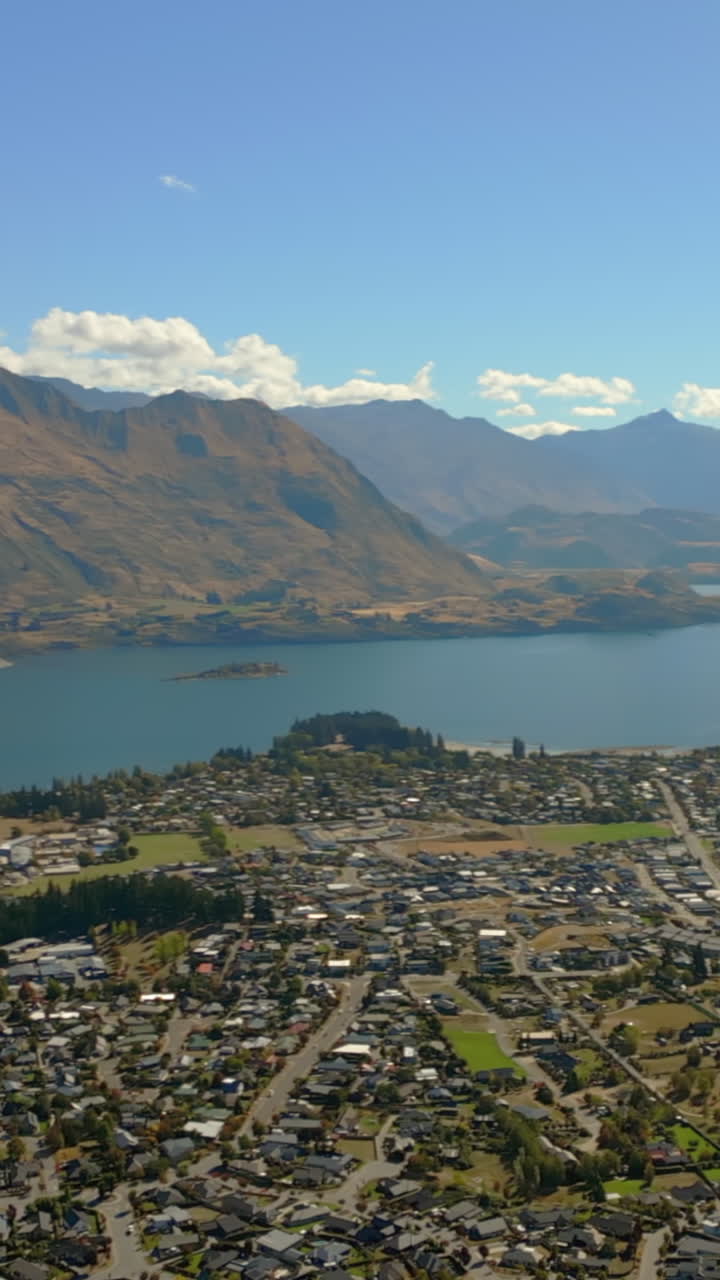 Wanaka resort town and Lake Wānaka basin South Island, New Zealand - vertical aerial panoramic parallax