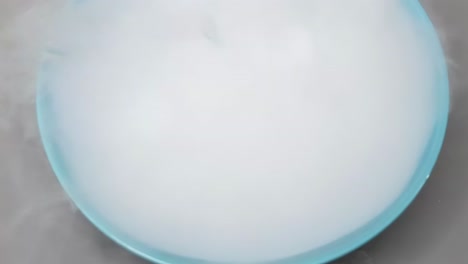 watch dry ice sublimate in a blue bowl, creating dense fog and vapor.