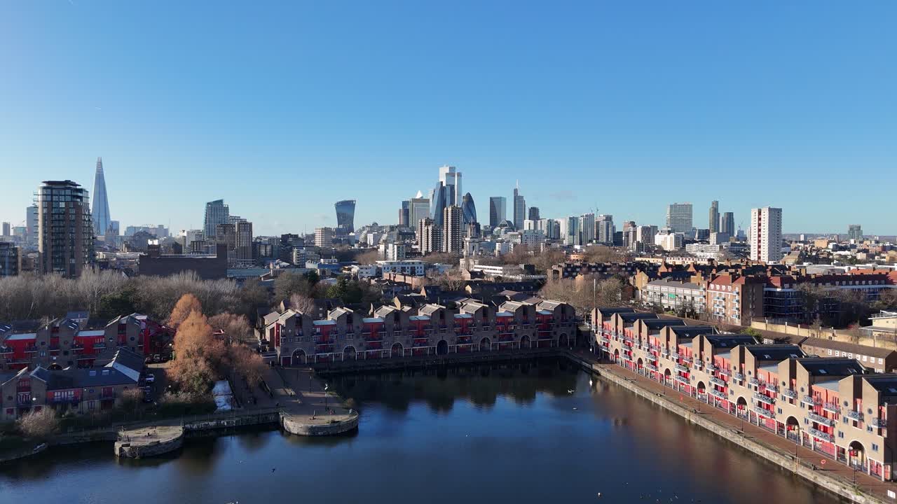 London City skyline Jan 2025 viewed from Shadwell Basin ascending aerial