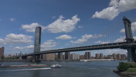 handheld panning shot of manhattan seen from brooklyn, sunny cloudy summer day