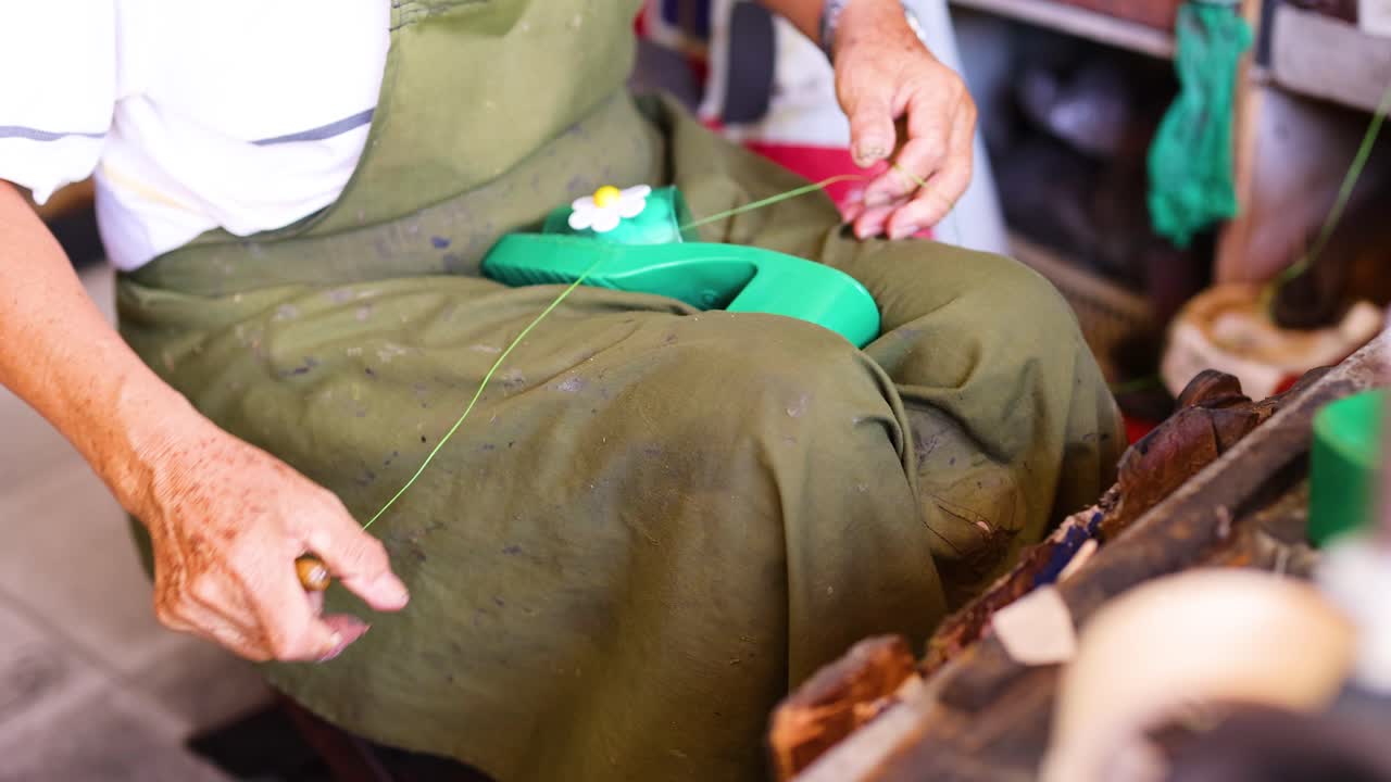 Shoemaker Repairing Shoes