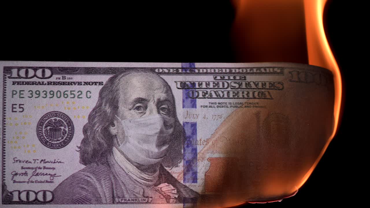 100 in a medical mask. The crisis in the global economy during the COVID-19 pandemic. High quality 4k footage