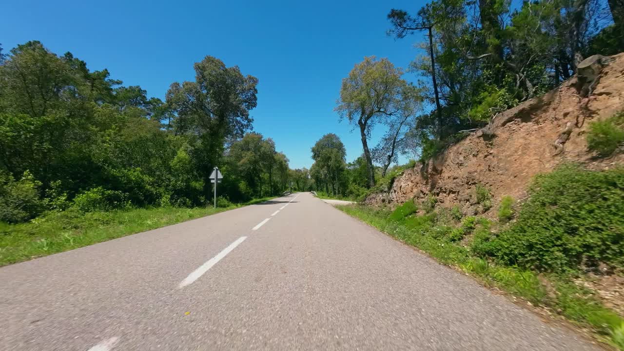POV shot of a road cyclist cornering while descending down a rural country road at high speed, Catalunya, Spain