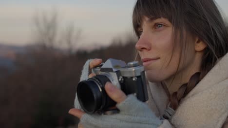 Woman taking photos with vintage camera