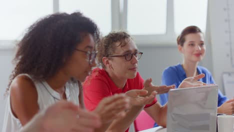 Professional colleagues sitting at negotiating table