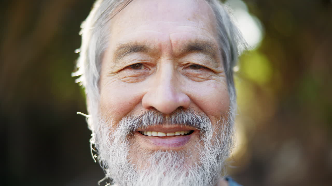 Portrait of a Smiling Senior Man with White Beard